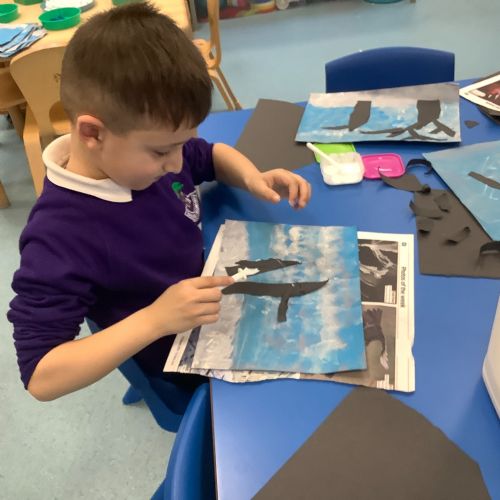 Ripping paper to create trees - the next step in our Claude Monet winter art work.