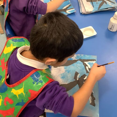 Winter Paintings - We used a thin paintbrush to paint snow on the trees.